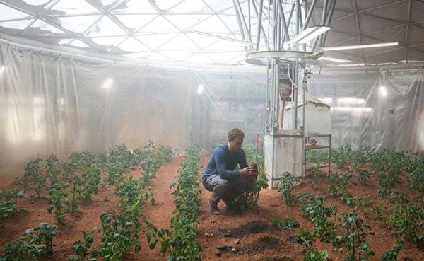 Mark Watney, portrayed by Matt Damon, growing potatoes